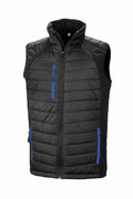 Introducing the R238X by Result Genuine Recycled: a black quilted sleeveless vest featuring blue zippers on the front pockets and chest pocket, complete with a high collar and zip closure. This lightweight vest is ideal for both casual or outdoor wear.