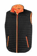 The Result Genuine Recycled R239X is a black puffer vest with orange lining and zipper, featuring orange zippered pockets.