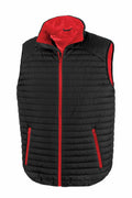 The R239X by Result Genuine Recycled, featuring a black puffer design with red lining and red zippers, is displayed against a white background.