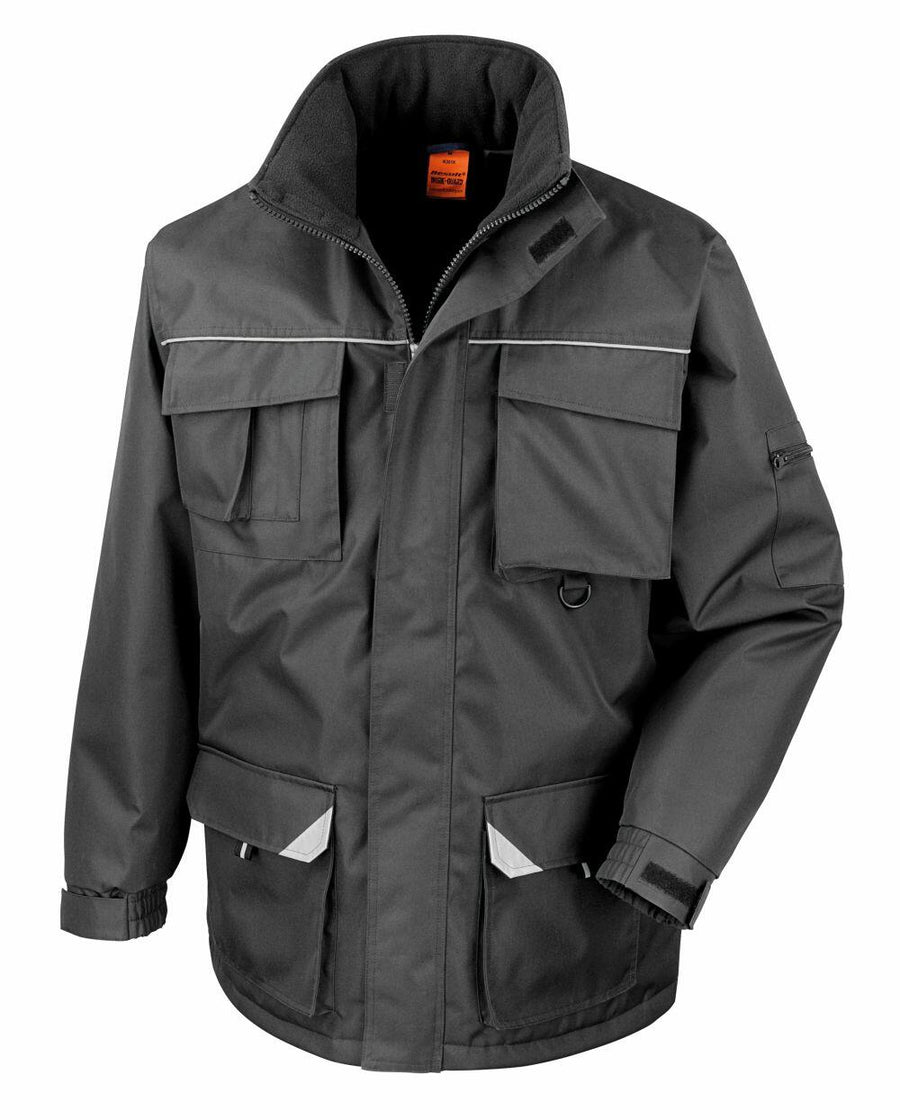 Introducing the Result Work-Guard R301X: a gray work jacket equipped with multiple pockets, a high collar, reflective trim, and Velcro cuffs.