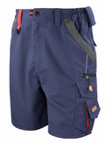 R311X by Result Work-Guard is a pair of blue work shorts featuring multiple pockets, red accents, and a gray belt loop, designed for utility and comfort.