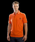 A man wearing an orange Result R312X polo shirt and dark pants stands against a black background. He has a pen in the shirt's front pocket.
