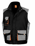 R317X utility vest by Result Work-Guard, featuring black and gray tones with multiple pockets and orange accents, displayed on a white background.