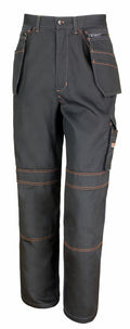 The R323X by Result Work-Guard are black work pants accented with orange stitching, boasting several pockets and featuring cargo pockets on the sides along with zipper details at the top.