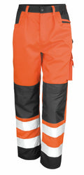 The R327X by Result Safe Guard are orange and black high-visibility work pants featuring reflective stripes and multiple pockets.