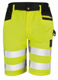 The R328X by Result Safe Guard are bright yellow and black work shorts, designed with reflective strips. They feature front pockets, a zippered side pocket, and a button closure at the waist.