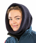 A person wearing a dark Result R361X hood over a blue and black jacket, smiling at the camera.
