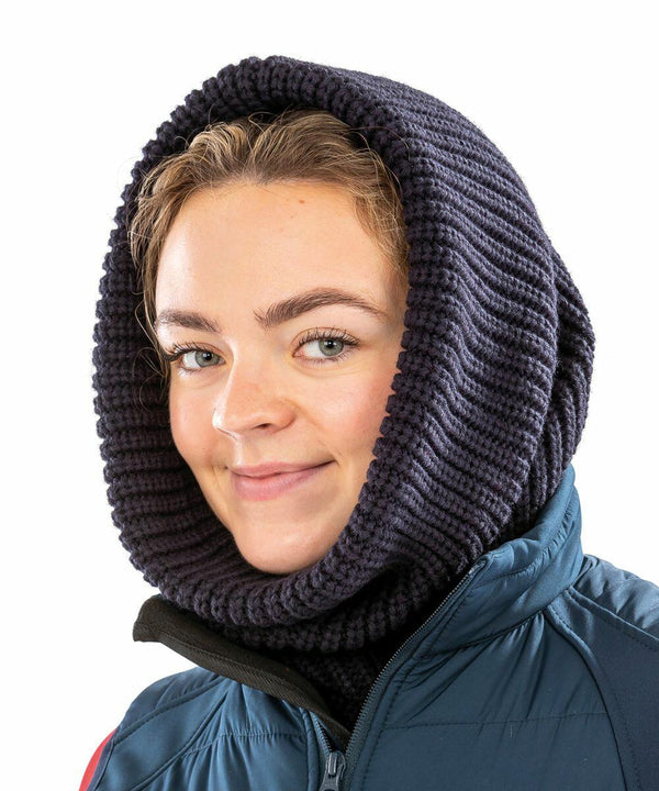 A person wearing a dark Result R361X hood over a blue and black jacket, smiling at the camera.