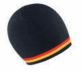 A beanie from Result Winter Essentials, model R368X, featuring a black design with red, orange, and yellow stripes along the bottom edge.