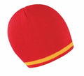 Introducing the R368X from Result Winter Essentials: a vibrant red knitted beanie featuring a distinctive single yellow stripe near the edge, beautifully showcased against a clean white background.