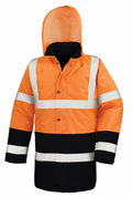 Result Core's R452X jacket is a high-visibility safety garment in orange and black, featuring reflective white stripes and a hood.