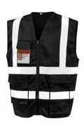 The R477X by Result Safeguard is a black safety vest featuring white reflective stripes, a front zipper, multiple pockets, and an ID badge holder.