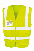Result Safeguard's R477X safety vest features a bright yellow color with white reflective stripes and includes a clear pocket on the left side for an ID badge.