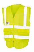 R479X by Result Safeguard: A yellow safety vest featuring white reflective stripes and multiple pockets, showcased against a white background.