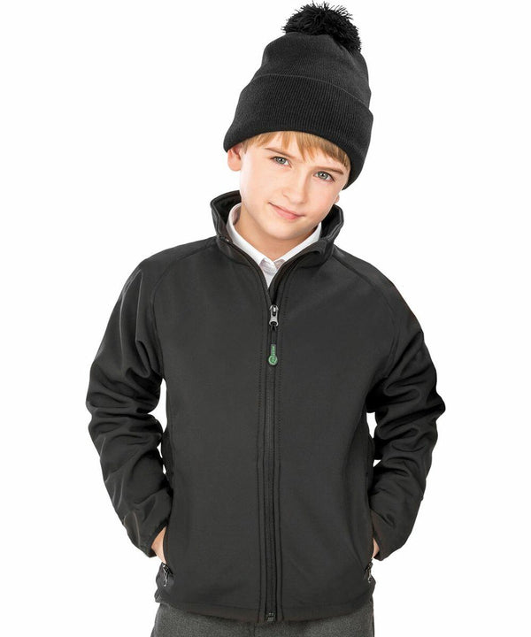 A young boy wearing a black beanie and a black Result R901J with his hands in his pockets.