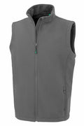 The Result Genuine Recycled R902M vest is gray and sleeveless, equipped with a full zipper and a high collar. It includes two zippered side pockets, and its smooth material makes it ideal for layering in cooler weather.