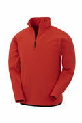 Introducing the R905X by Result Genuine Recycled, a vibrant red fleece pullover featuring long sleeves, a high collar, and a convenient half-zip front. The soft fabric makes it an excellent choice for cold weather. Displayed against a crisp white background, this stylish pullover is perfect for your wardrobe.