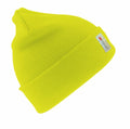 A vibrant yellow knit beanie, known as RC033 from Result Winter Essentials, features a small tag on its folded edge showcasing the logo and text. This beanie boasts a simple yet stretchy design ideal for cold weather.