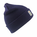 The RC033 knit beanie from Result Winter Essentials is in dark blue, featuring a folded brim and a small label with red and white text on the side. The beanie is angled against a white background for display.