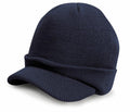 Result Winter Essentials' RC060 is a navy blue knit cap with a brim, designed for warmth and style.