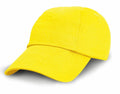 A bright yellow baseball cap from Result Headwear, model RC18J, is displayed. The cap features a curved brim and has a plain design without any logos or embellishments. It sits against a white background, where it casts a gentle shadow.
