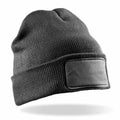 RC27X knit beanie by Result Winter Essentials, featuring a blank rectangular patch on the front, presented against a white background.