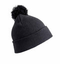 RC28J by Result Winter Essentials is a black knit beanie featuring a pom-pom on top, showcased at an angle against a white background.