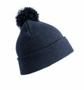A Result Winter Essentials RC28J dark blue knit beanie featuring a folded brim and a large pom-pom on top.