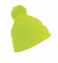 The RC28X by Result Winter Essentials is a vibrant green beanie featuring a pom-pom on top, displayed against a white background. The hat showcases a folded brim with a straightforward knit design.