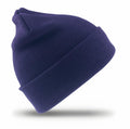 A navy blue RC29J knitted beanie by Result Winter Essentials, featuring a folded brim, displayed against a white background with a subtle shadow underneath.