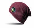 A maroon ribbed beanie with a round, colorful patch featuring the text "Result Winter Essentials." The RC31X beanie is displayed against a white background.