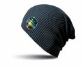 Product Description: The RC31X by Result Winter Essentials, a dark ribbed beanie featuring a reflective round patch with vibrant text on the side, displayed against a white background.