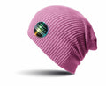 The RC31X beanie from Result Winter Essentials is a pink knitted hat adorned with a circular brand patch on the side, showcasing a multicolored design and text. It is presented against a white background with a subtle shadow beneath it.