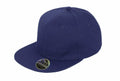 The RC83X cap from Result Headwear is a sleek dark blue snapback featuring a flat brim. A small sticker on the brim highlights the brand's text and logo, with the cap showcased against a white backdrop.