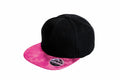 A black baseball cap with a pink, textured visor from Result Headwear, featuring a snapback sticker and known as the RC87X.