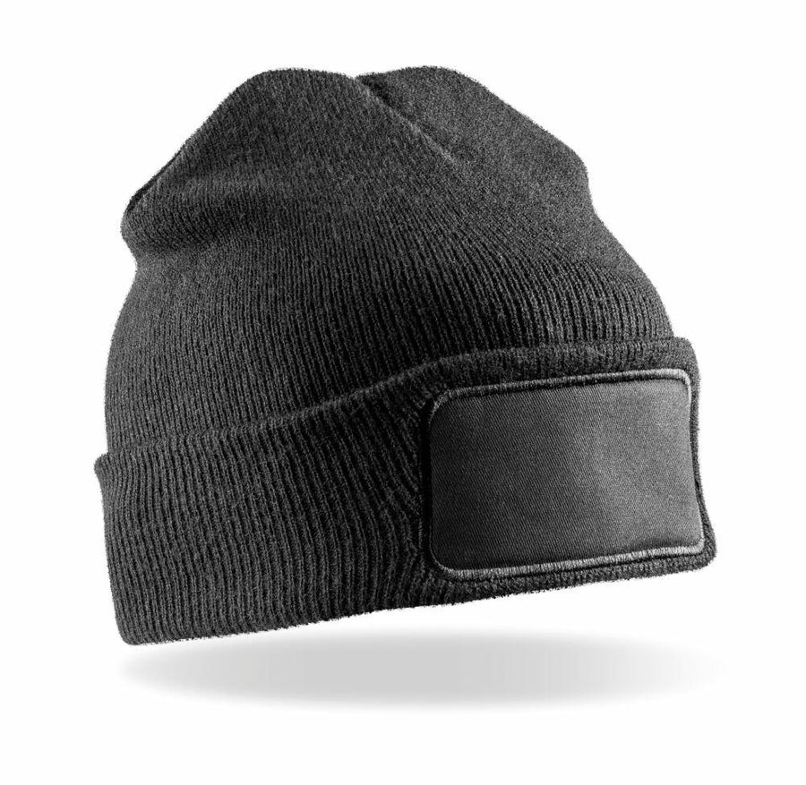 The RC934 black knit beanie by Result Genuine Recycled features a rectangular patch on the front and is showcased against a white background.