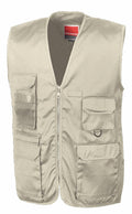 The Result Workguard RE45A is a beige utility vest featuring multiple pockets, a front zipper, and mesh lining.