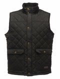 Regatta Professional's RG077 features a quilted black design with a high collar, front button closure, and two spacious flap pockets.