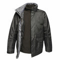 Regatta Professional's RG110: A dark green rain jacket featuring a high collar and a zippered front over an olive green inner layer, showcased on a white background.