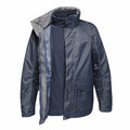 Displaying the interior lining, the RG110 by Regatta Professional is a blue jacket with a hood and features both zip and velcro closures.