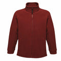 The RG122 from Regatta Professional is a red fleece jacket featuring a high collar, full front zipper, and two side pockets.