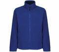 Introducing the RG122 by Regatta Professional: a fleece jacket in blue featuring a high collar and zippered front. This design includes long sleeves and two side pockets, offering a simple and minimalist style without visible logos or patterns.