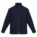 The RG125 jacket by Regatta Professional, a plain black zip-up with long sleeves and two zipped pockets, is showcased against a white background.