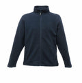 The RG138 by Regatta Professional is a navy blue zip-up fleece jacket featuring long sleeves and two front pockets.