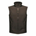 Discover the RG148 by Regatta Professional: a sleek, dark green sleeveless vest featuring a zip-up design, high collar, and two convenient front pockets.