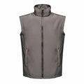 The RG148 by Regatta Professional is a gray sleeveless vest featuring a front zipper and two side pockets, showcased against a white background.