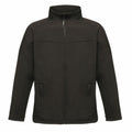 Product: RG150 by Regatta Professional, a black, long-sleeve jacket featuring a high collar with a zip-up design and two front pockets.