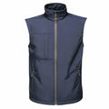 The RG164 from Regatta Professional is a sleeveless vest in dark blue, designed with a high collar and a front zipper. It includes two side pockets and one chest pocket for added convenience.