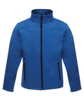 The Regatta Professional RG194 is a blue zip-up jacket with a high collar, designed with black zippers on the front pockets and one vertical chest pocket. Made from softshell material, it provides a modern and casual appearance.