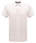 Introducing the RG300 by Regatta Professional: a plain white polo shirt featuring short sleeves, a collar, and a three-button placket. This stylish piece is showcased against a simple white background.